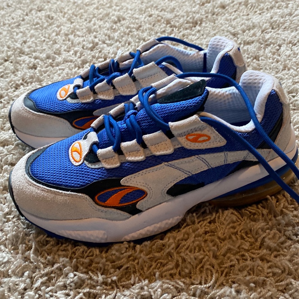 blue white black and orange puma sneakers